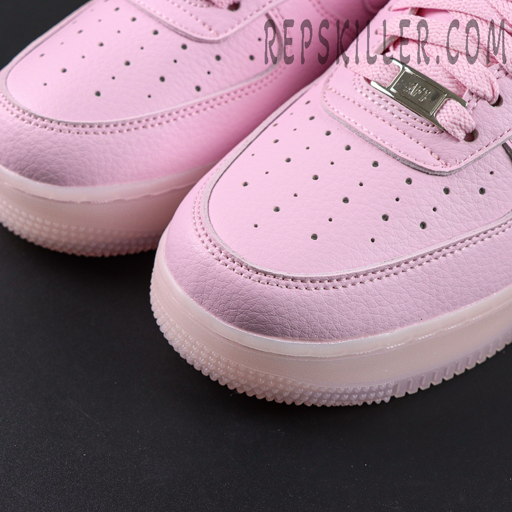 Close-up of NOCTA x Air Force 1 “Pink Foam” toe box showing perforations and premium leather texture.
