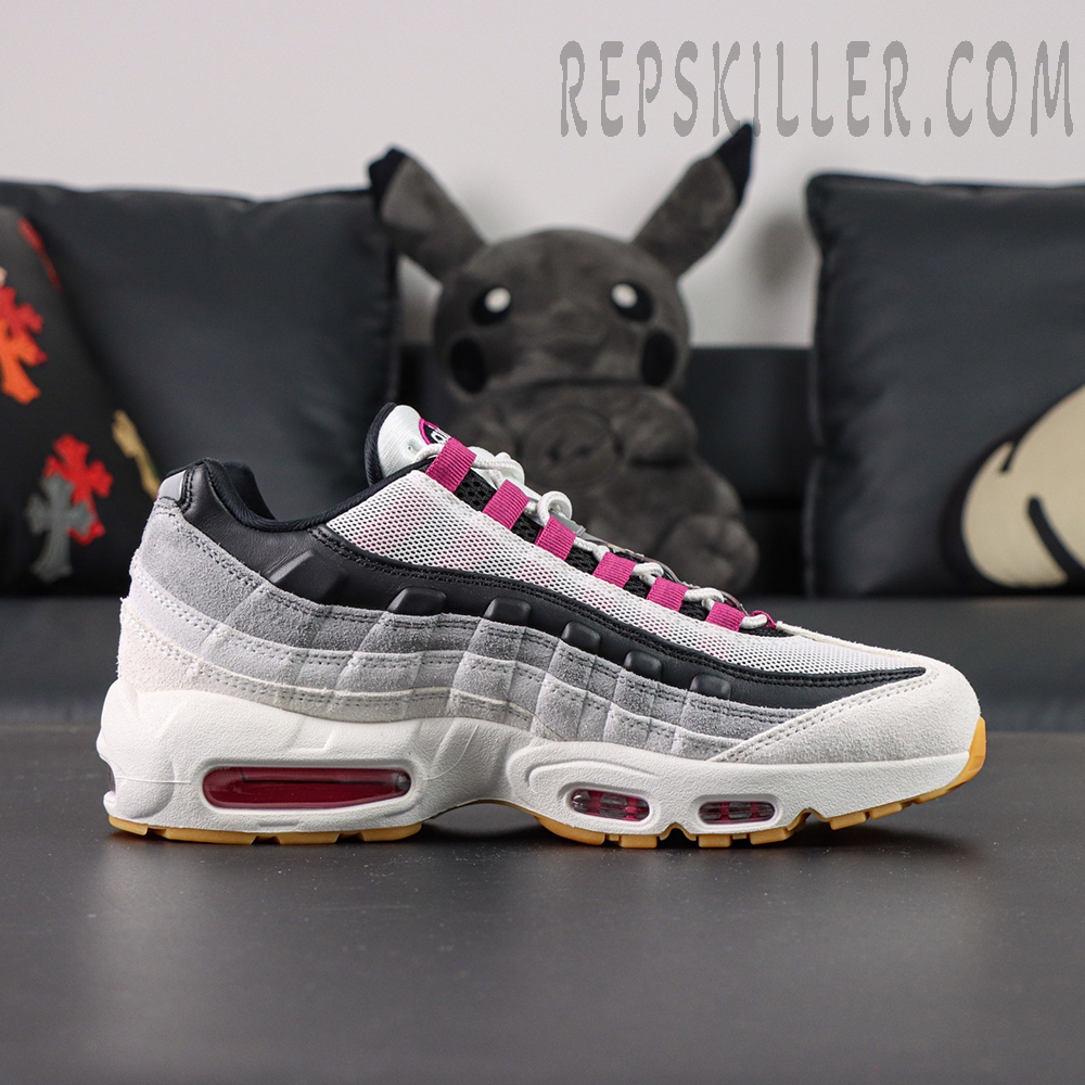 Side profile of Nike SB x Air Max 95 “Cactus Flower” showing layered white, grey, and black upper with pink lace loops.