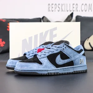 Side view of Supreme x Nike SB Dunk Low “Ocean Fog” with Nike box in background, highlighting the blue and black color contrast.