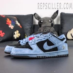 Angled side shot of Supreme x Nike SB Dunk Low “Ocean Fog,” emphasizing the embroidered “94” on the heel.