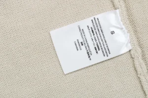 Fear Of God Essentials 1977 Flocked Hoodie Knit Sweater Beige Wash label