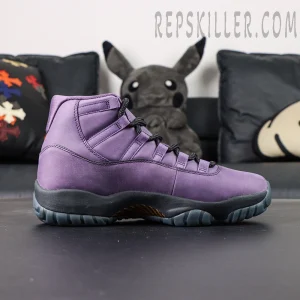 Side profile view of the Jordan 11 Retro ‘Mojave’ showcasing the purple suede upper and dark midsole.