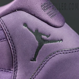 Close-up of the black Jumpman logo on the purple suede upper of the Jordan 11 Retro ‘Mojave’.