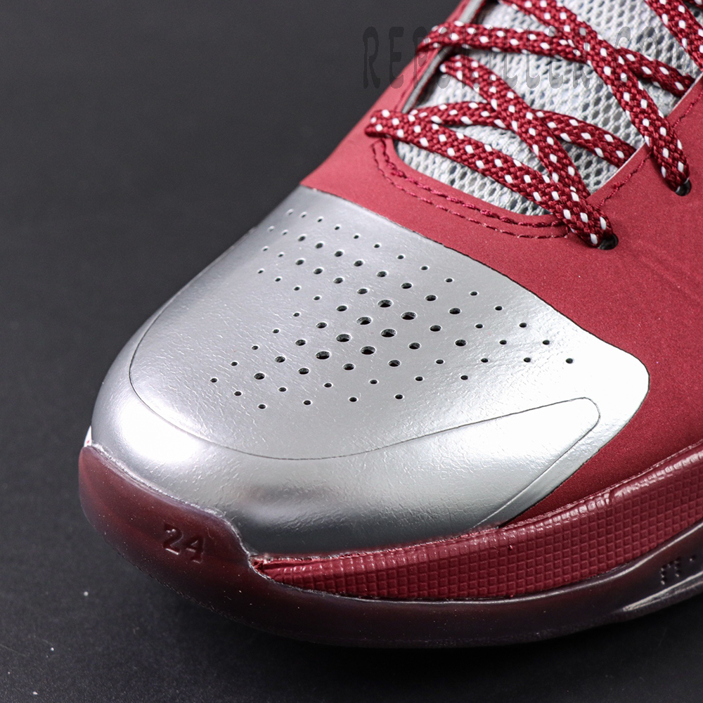 Close-up of Kobe 5 Protro ‘Lower Merion Aces’ silver and red upper showing perforated toebox and red laces.