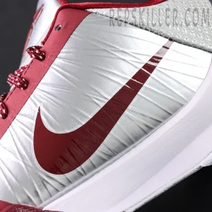 Close-up of red Nike Swoosh on silver upper of Kobe 5 Protro ‘Lower Merion Aces’.