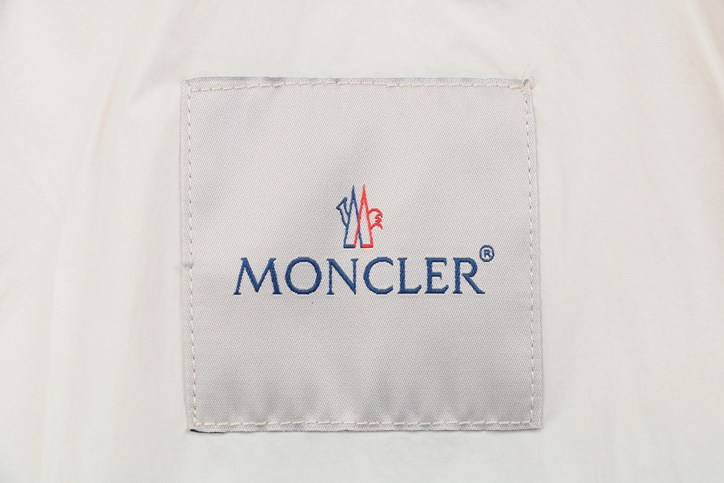 Mxxcler x 1017 ALYX 9SM Triple-Zip Hooded Down Jacket White Brand label