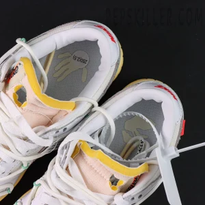 Off-White x Nike Dunk Low Lot 01 of 50 insole close-up showing hand graphic and foam tongue details