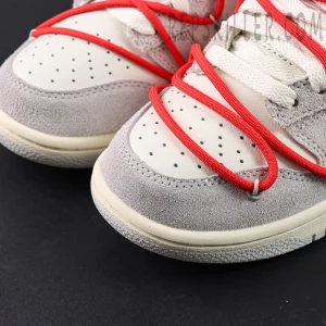 Close-up of Off-White x Nike Dunk Low Lot 33 of 50 toe box showing perforated leather and grey suede mudguard.