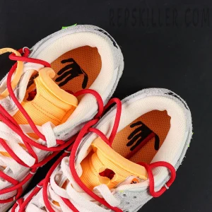 Insole detail of Off-White x Nike Dunk Low Lot 40 of 50 highlighting hand graphic print and orange exposed foam tongue