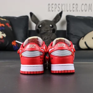 Angled pair shot of the Off-White Dunk Low “University Red” emphasizing layered textures, industrial-inspired details, and streetwear aesthetic.