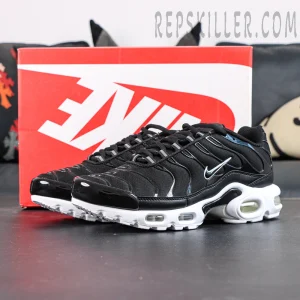 Side front view of Nike Air Max Plus Black White with original Nike shoebox in background
