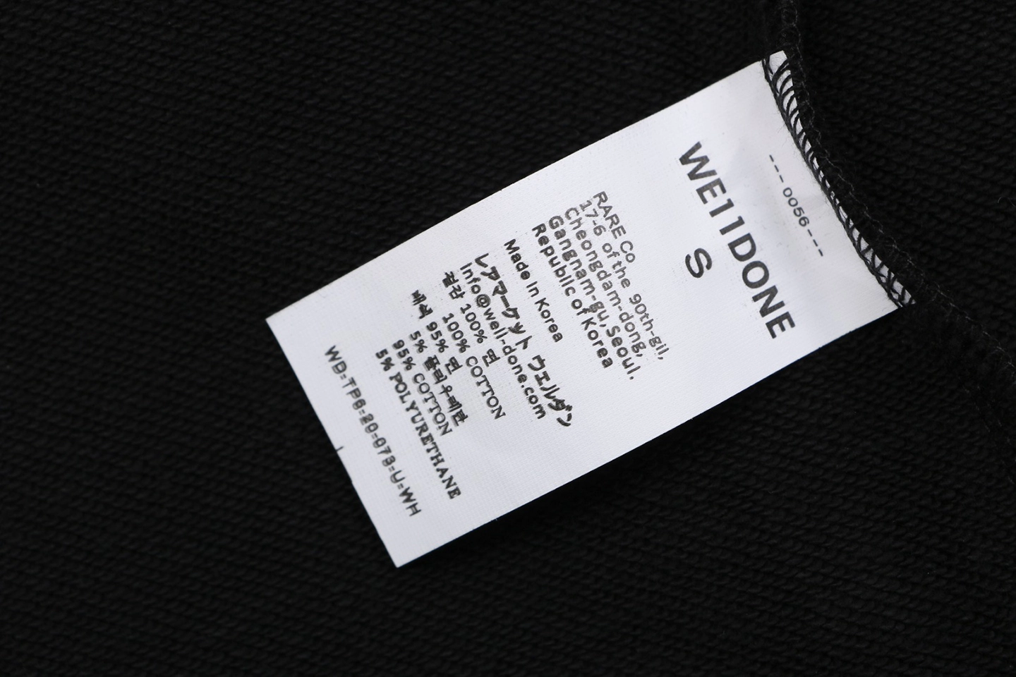 We11done Three-Eye Deer Graphic Zip-Up Hoodie Wash label