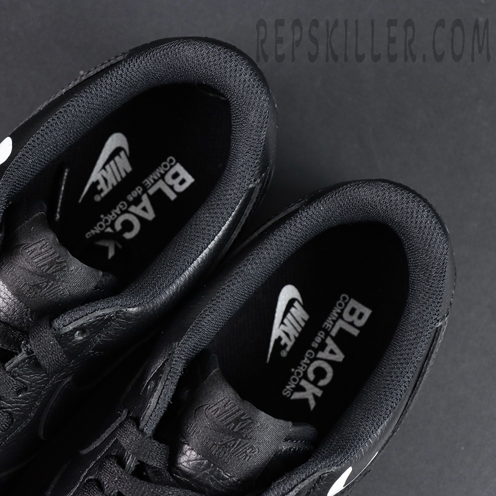 BLACK Comme des Garçons x Nike Air Force 1 Low black collaboration sneakers, inner lining view with BLACK CDG and Nike co-branding