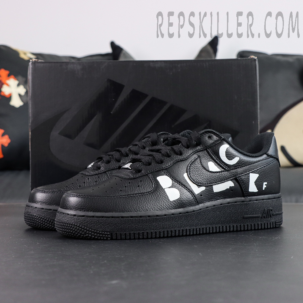 BLACK Comme des Garçons x Nike Air Force 1 Low black collaboration sneakers displayed with original black shoebox