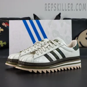 CLOT x BAPE x adidas Superstar “Off White Olive Cargo” sneakers, pair displayed side by side with special edition shoebox