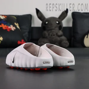 Nike Mind 001 Mule “Light Smoke Grey” mule shoes, rear angle view with metallic Nike branding plate