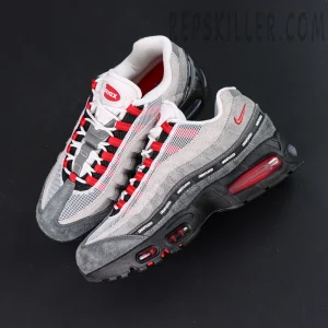 Undefeated x Nike Air Max 95 “Bright Crimson” sneakers, top-down view highlighting tongue and red inner lining