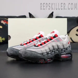 Undefeated x Nike Air Max 95 “Bright Crimson” sneakers, pair displayed at front-side angle