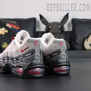 Undefeated x Nike Air Max 95 “Bright Crimson” sneakers, rear angle showing Nike Air heel support structure