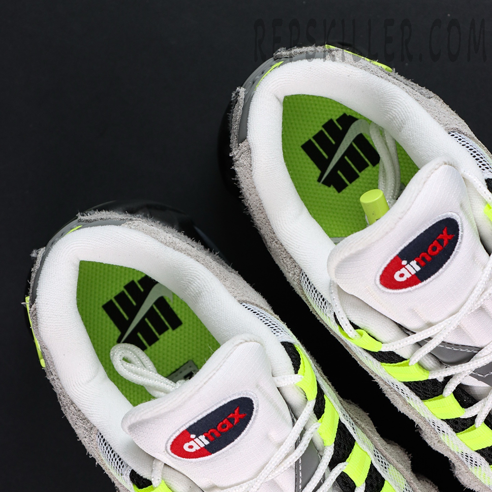 Undefeated x Nike Air Max 95 “NYC Neon” sneakers, top-down view showing tongue and neon green inner lining