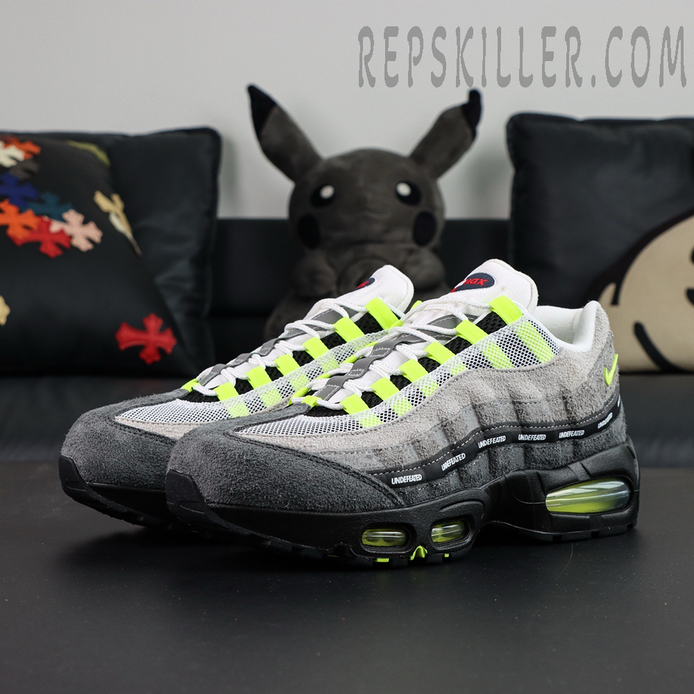 Undefeated x Nike Air Max 95 “NYC Neon” sneakers, pair displayed at front side angle