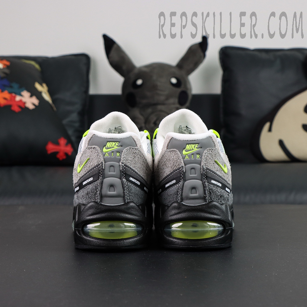 Undefeated x Nike Air Max 95 “NYC Neon” sneakers, straight rear view showing heel support and Air cushioning
