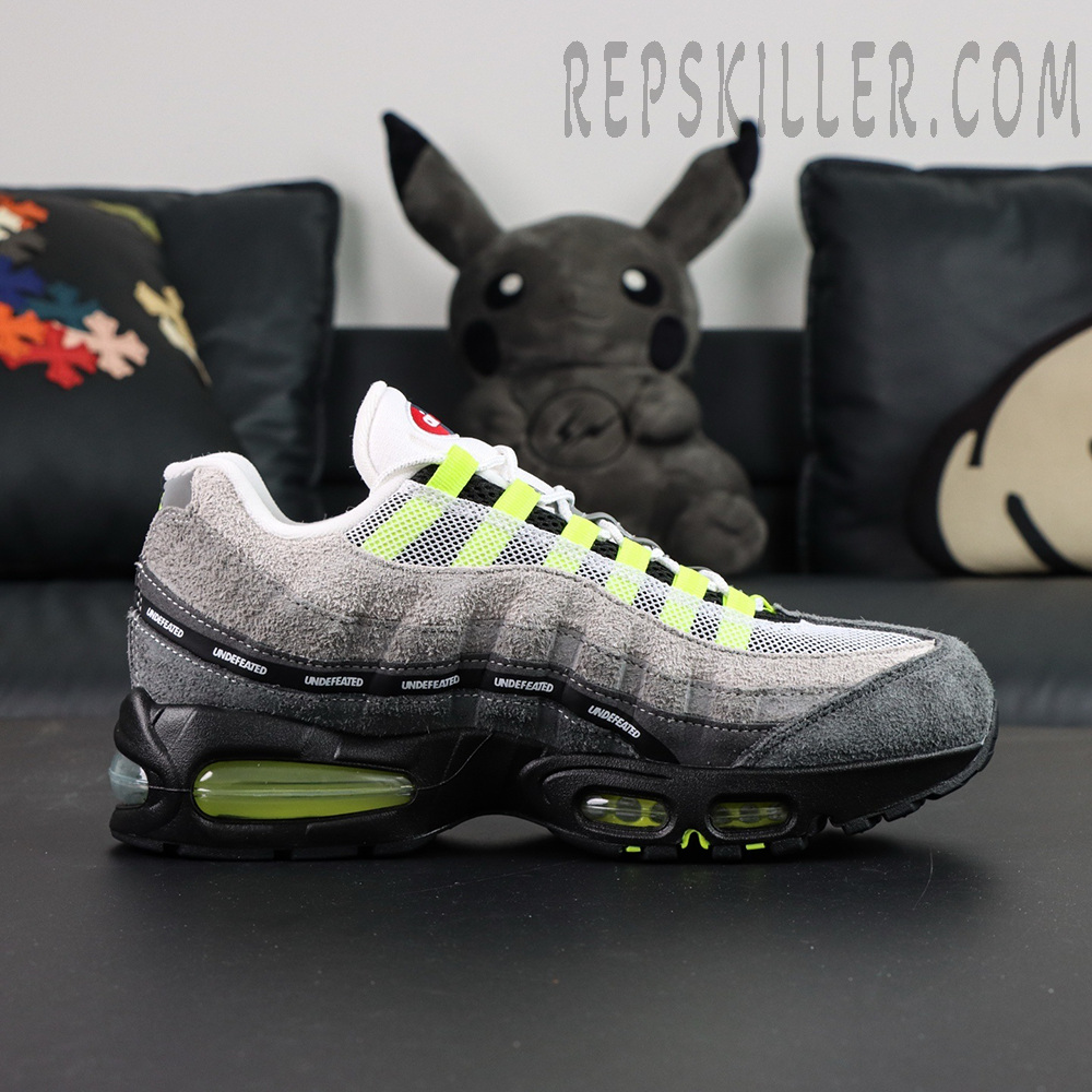 Undefeated x Nike Air Max 95 “NYC Neon” sneakers, medial side view showing layered upper and midsole detail