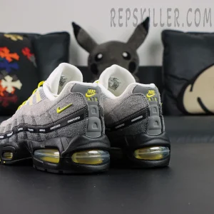 Undefeated x Nike Air Max 95 “Yellow” sneakers, rear side angle with yellow Swoosh and Air midsole