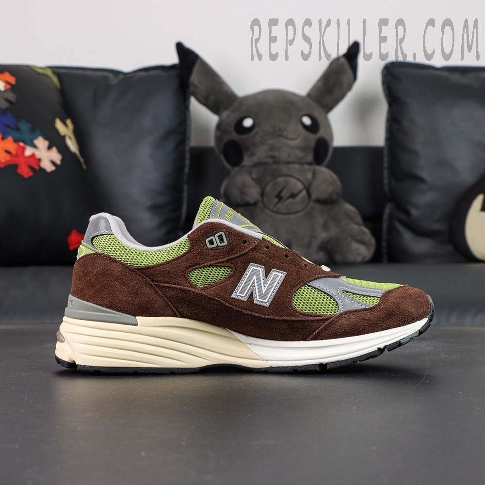 Daniëlle Cathari x Kith x New Balance 991v2 “Reverse” sneakers, lateral view featuring N logo and layered construction