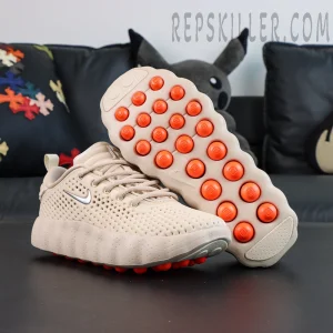 Nike Mind 002 “Light Khaki” outsole with bold orange cushioning pods