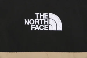 The North Face Retro Hidden Hood Windbreaker Jacket Brown Brand label