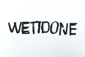 We11done Graffiti Brush Logo Print T-Shirt White Front Brand Print